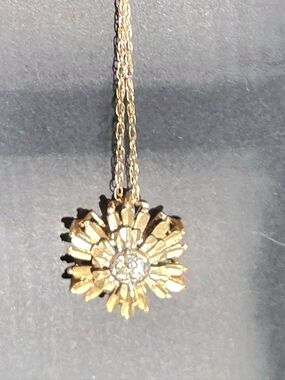 Gold star burst flower charm with solid gold 18 inch necklace